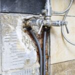 Why is My Hot Water Heater Leaking From the Bottom? Emergency Steps to Prevent Flooding